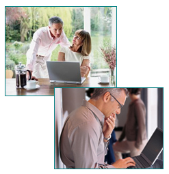 man and woman talking whilst using computer